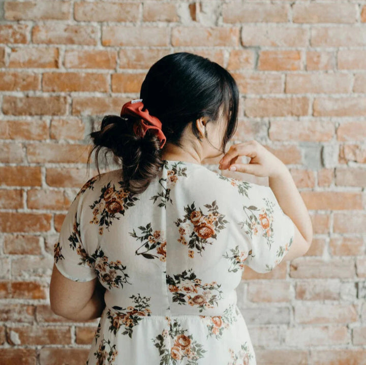 A terracotta-colored scrunchie.