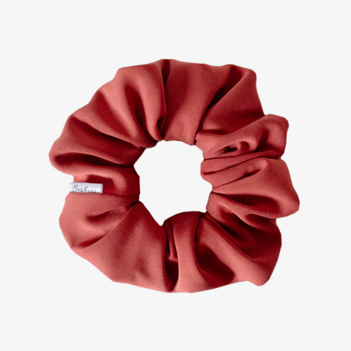 A terracotta-colored scrunchie.
