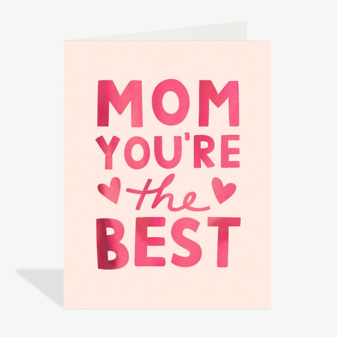Greeting card with 'Mom you're the best' text on a light pink background