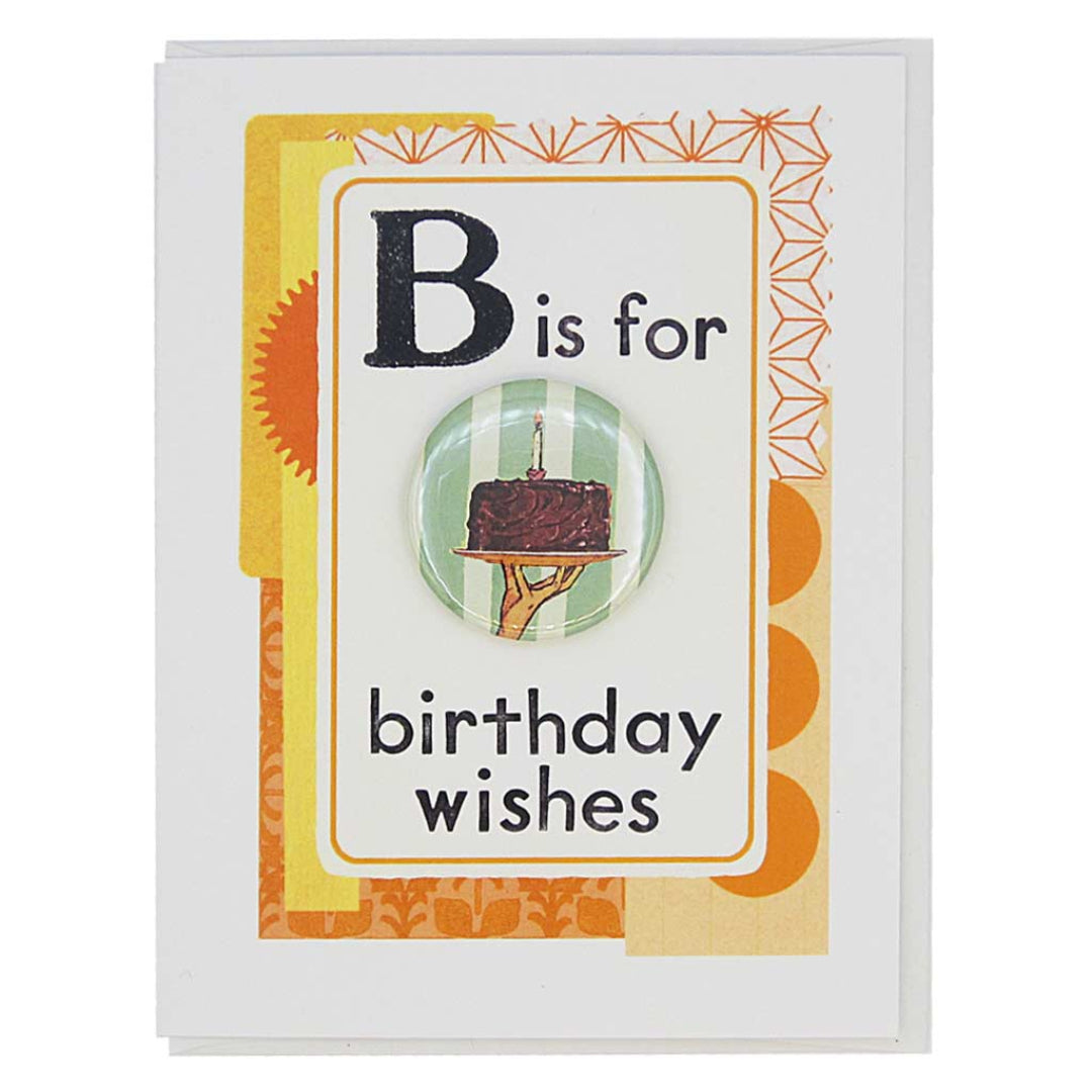 Greeting card with a button featuring a birthday cake illustration and text 'B is for birthday wishes' on a decorative background.