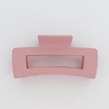 Pink hair clip on a white background