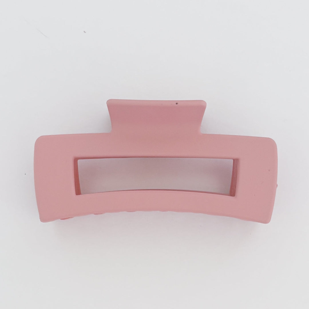 Pink hair clip on a white background