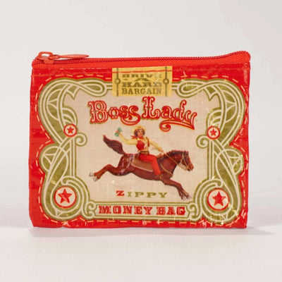 A small red coin purse with a zipper, featuring a vintage-style illustration of a woman riding a horse with a triumphant pose. The text 