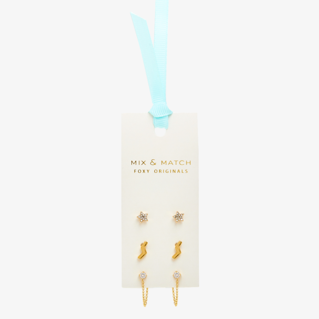 Set of gold earrings on a 'Mix & Match Foxy Originals' card with a blue ribbon.