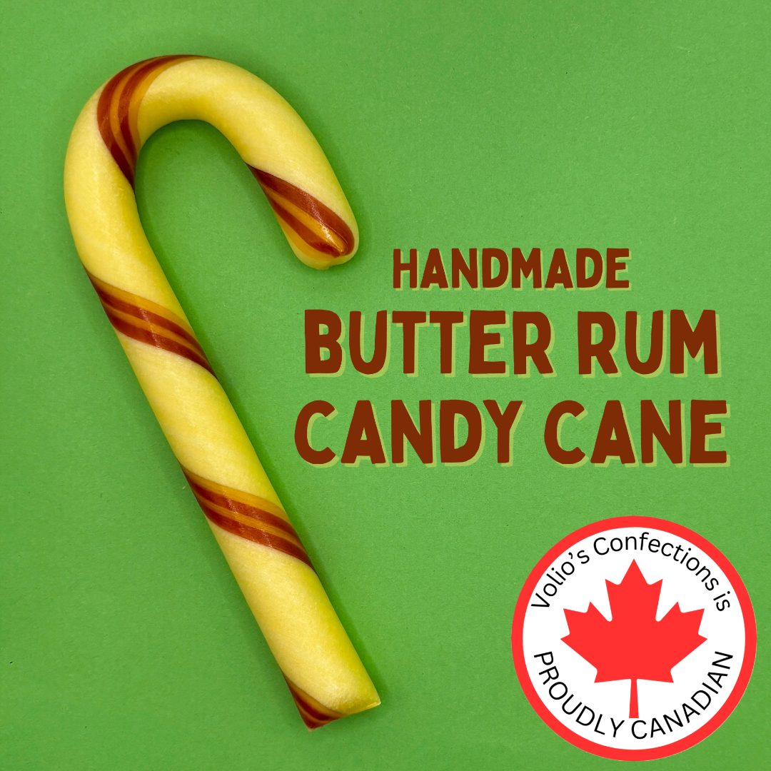 Handmade butter rum candy cane with Volio's Confections logo on a green background