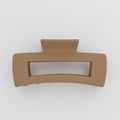 Brown hair clip on a white background