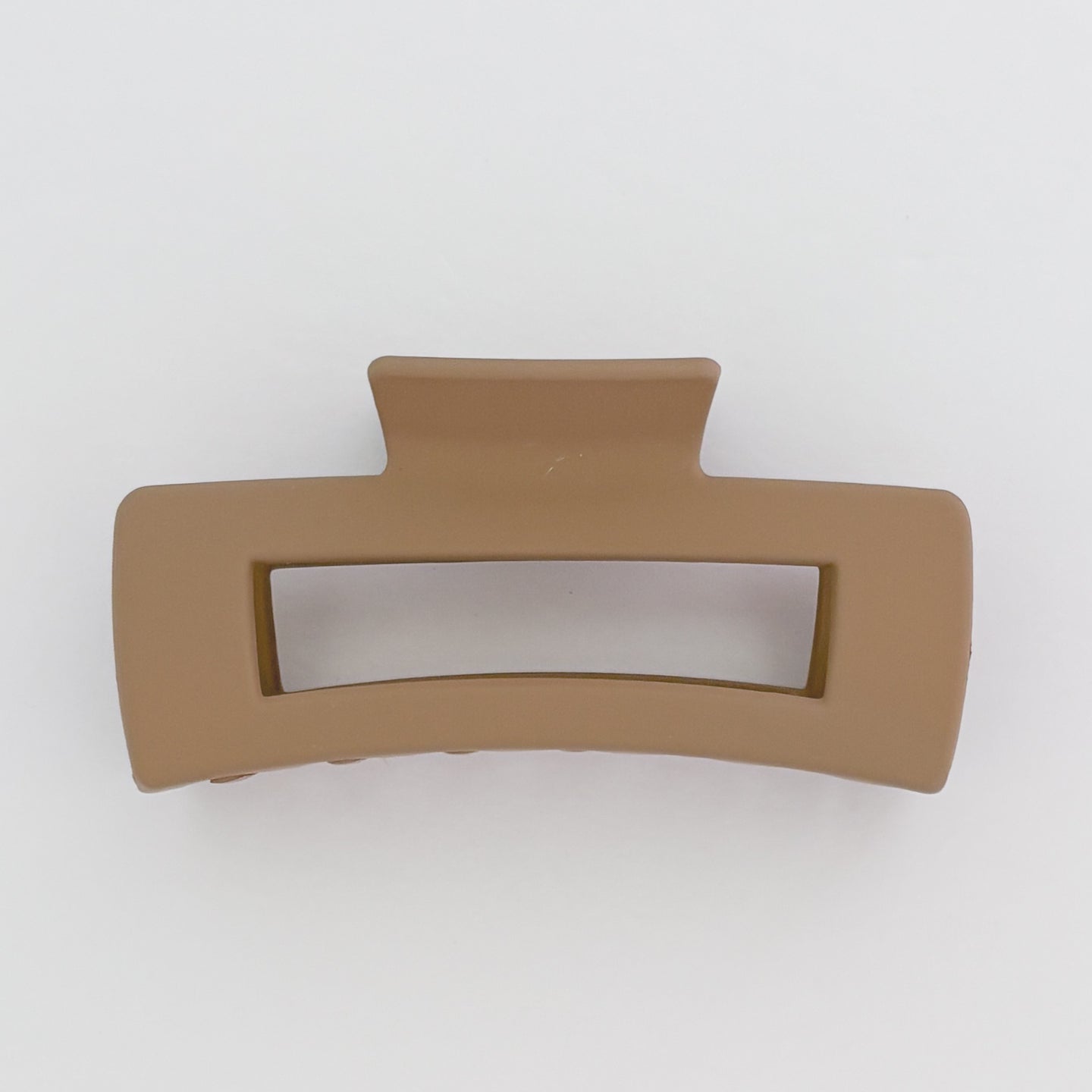 Brown hair clip on a white background