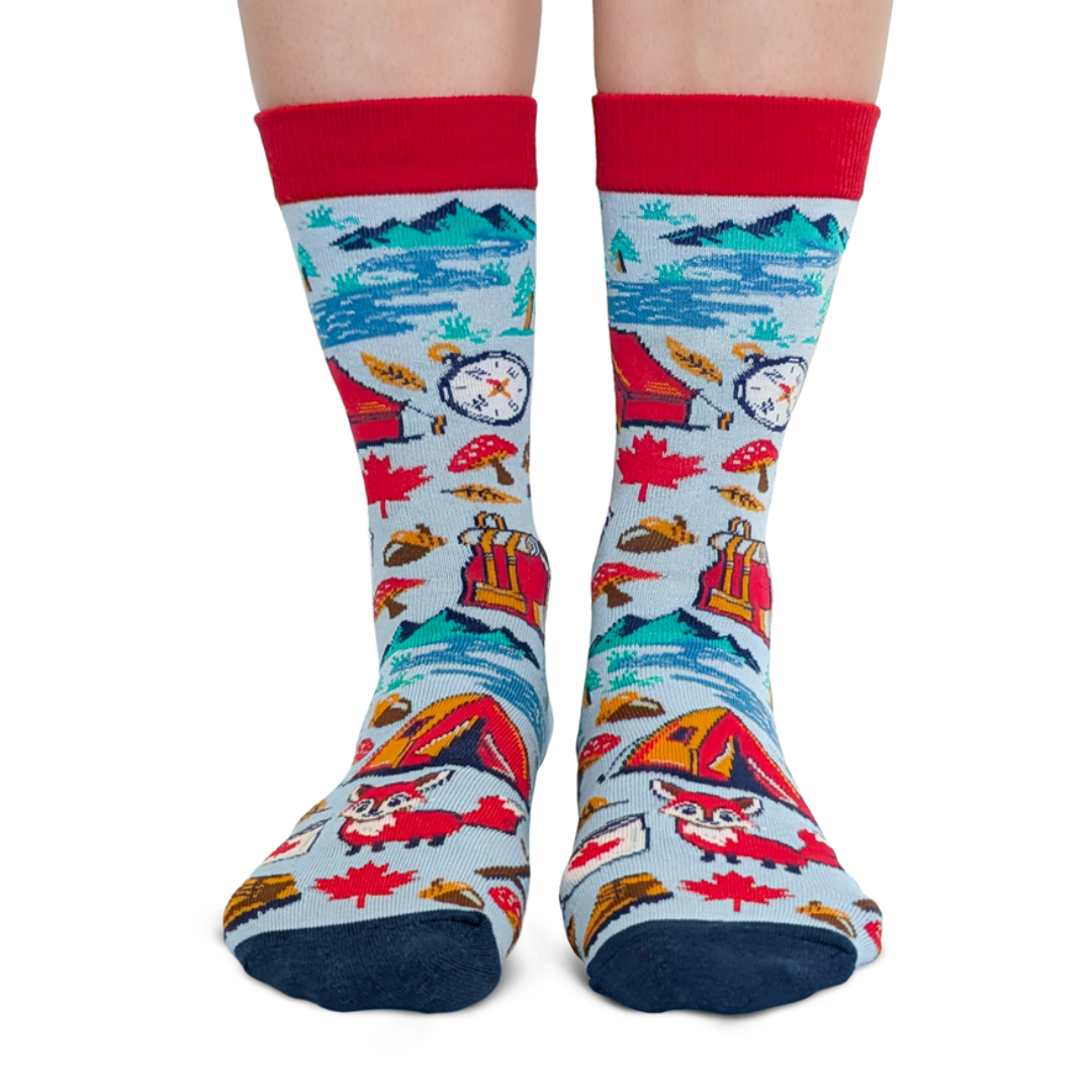 Colorful socks with camping-themed design on a white background