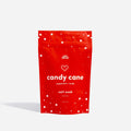 A red pouch of Epic Blend Candy Cane Peppermint Candy Salt Soak. The pouch has a white zipper and is decorated with white dots and candy cane stripes.