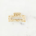 Rectangular bar of soap on a white marble surface