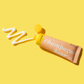 Product packaging with 'champagne hour' text on a yellow background