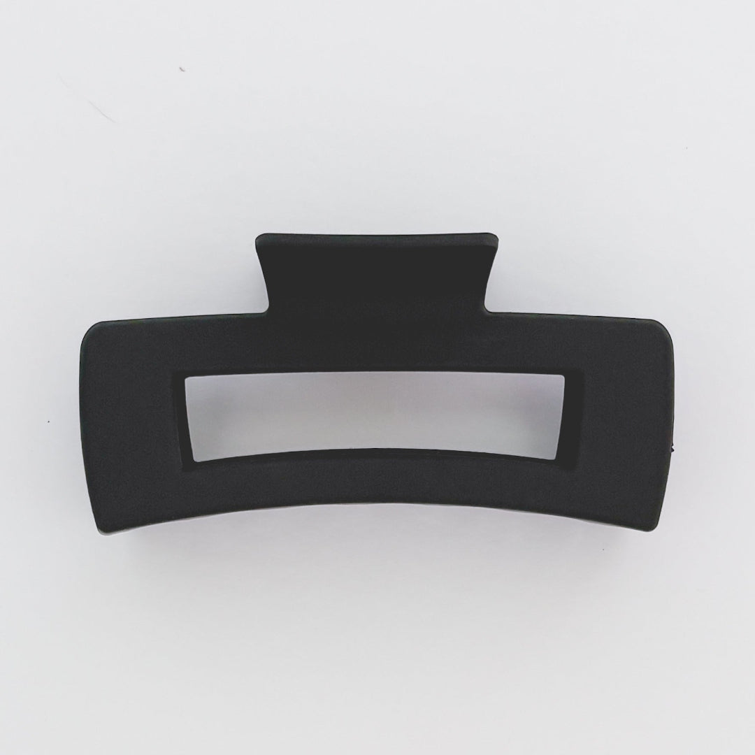 Black hair clip on a white background