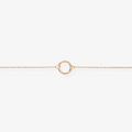 A delicate gold-toned charm necklace with a standard chain, featuring a simple circular charm, possibly Toniq brand, displayed on a white background. This minimalist necklace is available in Ottawa, Ontario, Canada.