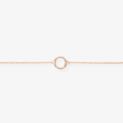 A delicate gold-toned charm necklace with a standard chain, featuring a simple circular charm, possibly Toniq brand, displayed on a white background. This minimalist necklace is available in Ottawa, Ontario, Canada.