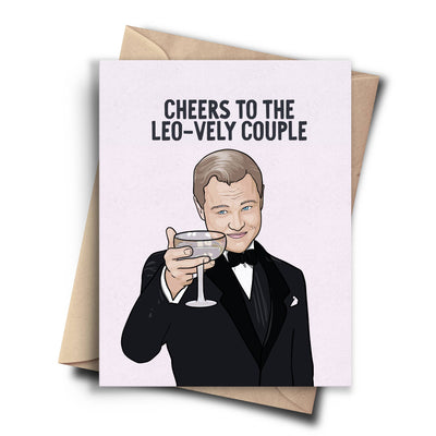 A humorous card featuring a cartoon drawing of Leonardo DiCaprio as Jay Gatsby from The Great Gatsby, holding a cocktail glass and winking. The text on the light pink background reads 