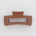 Brown hair clip on a white background