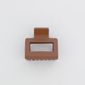 Brown hair clip on a white background