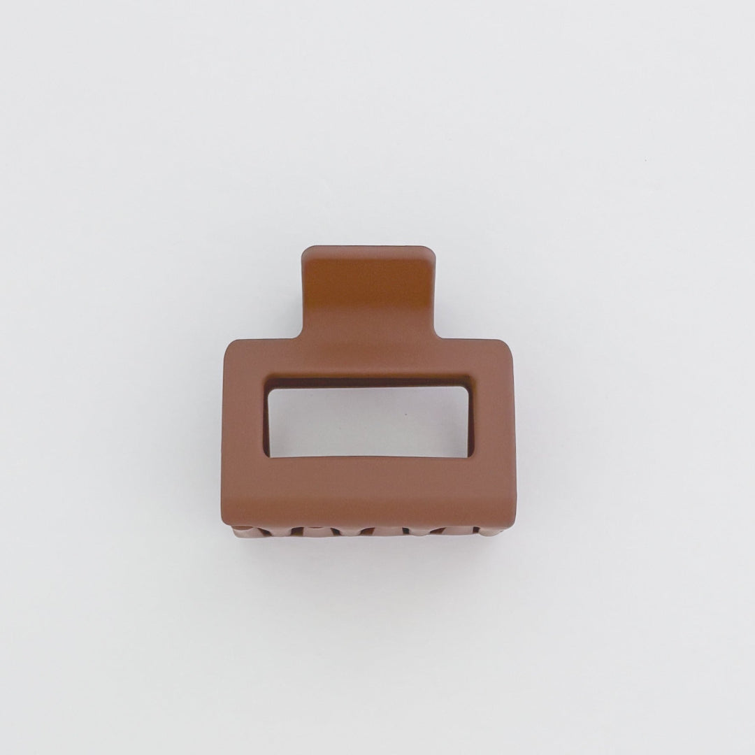 Brown hair clip on a white background