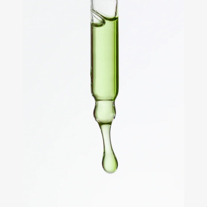 Aide Bodycare Clarifying Face Serum, featuring a small glass bottle with a dropper and a label with 'aide' logo, 'Clarifying Face Serum', and 'tansy & black cumin' text, displayed on a light-colored surface with a soft shadow. The serum is natural and available in Ottawa, Ontario, Canada.