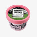 Pink container of Under Carriage deodorant cream with a black and white label on a white background