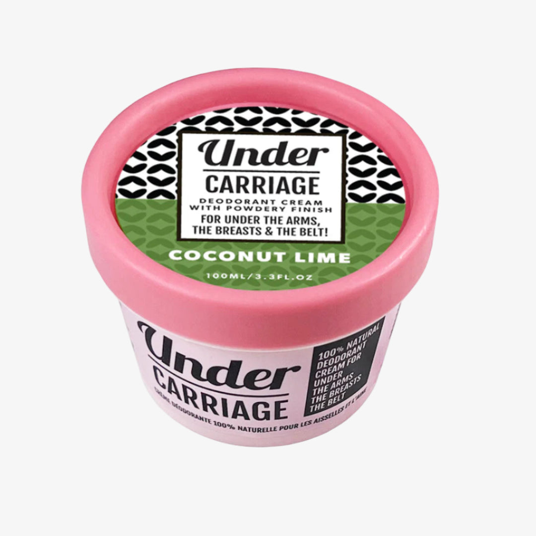 Pink container of Under Carriage deodorant cream with a black and white label on a white background