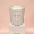 Candle labeled 'Coconut Cloud' by North Rose on a pink background