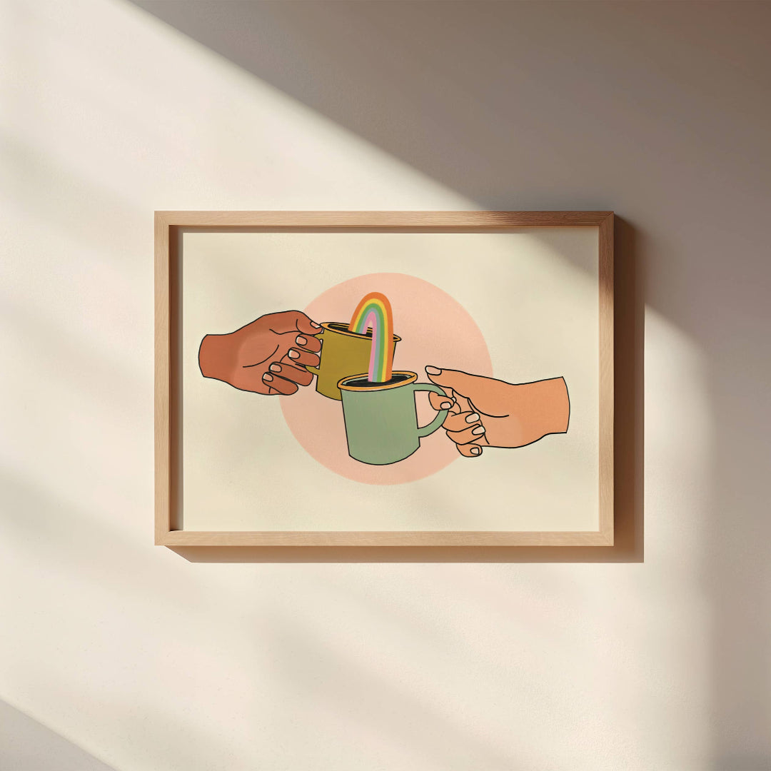 Framed artwork of two hands sharing a cup with a straw on a beige wall.