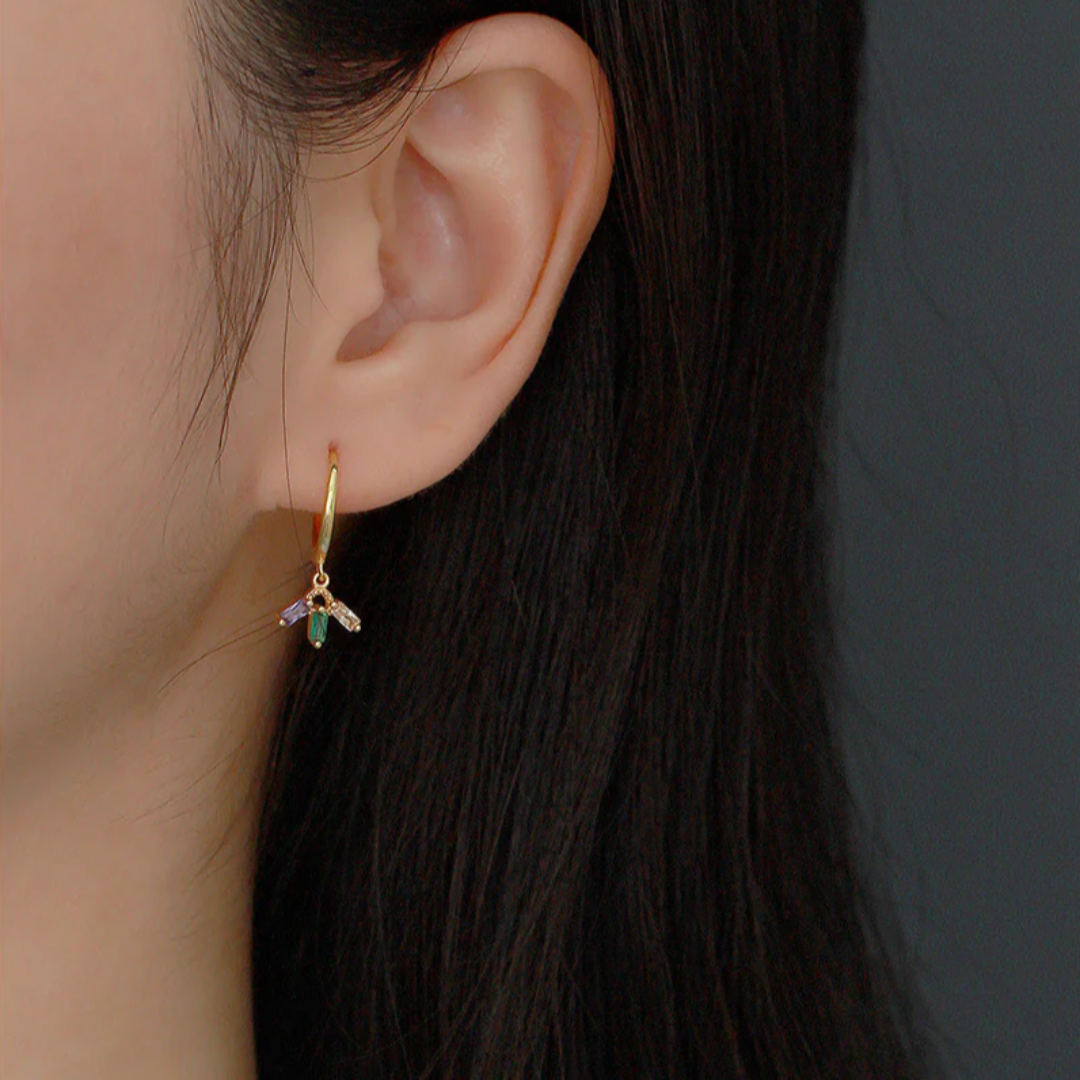 colourful crystal mini hoop earrings in gold, featuring small gold hoops with dangling clusters of purple, green, and peach rectangular crystals. These dainty and vibrant earrings are available in Ottawa, Ontario, Canada.