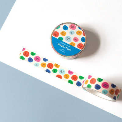 Colorful washi tape with a pattern of multicolored dots on a white background