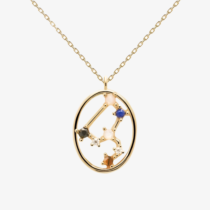 The Leo constellation necklace, featuring a delicate gold chain and an oval pendant outlining the Leo zodiac constellation with small, colorful gemstones. This celestial necklace is available in Ottawa, Ontario, Canada.