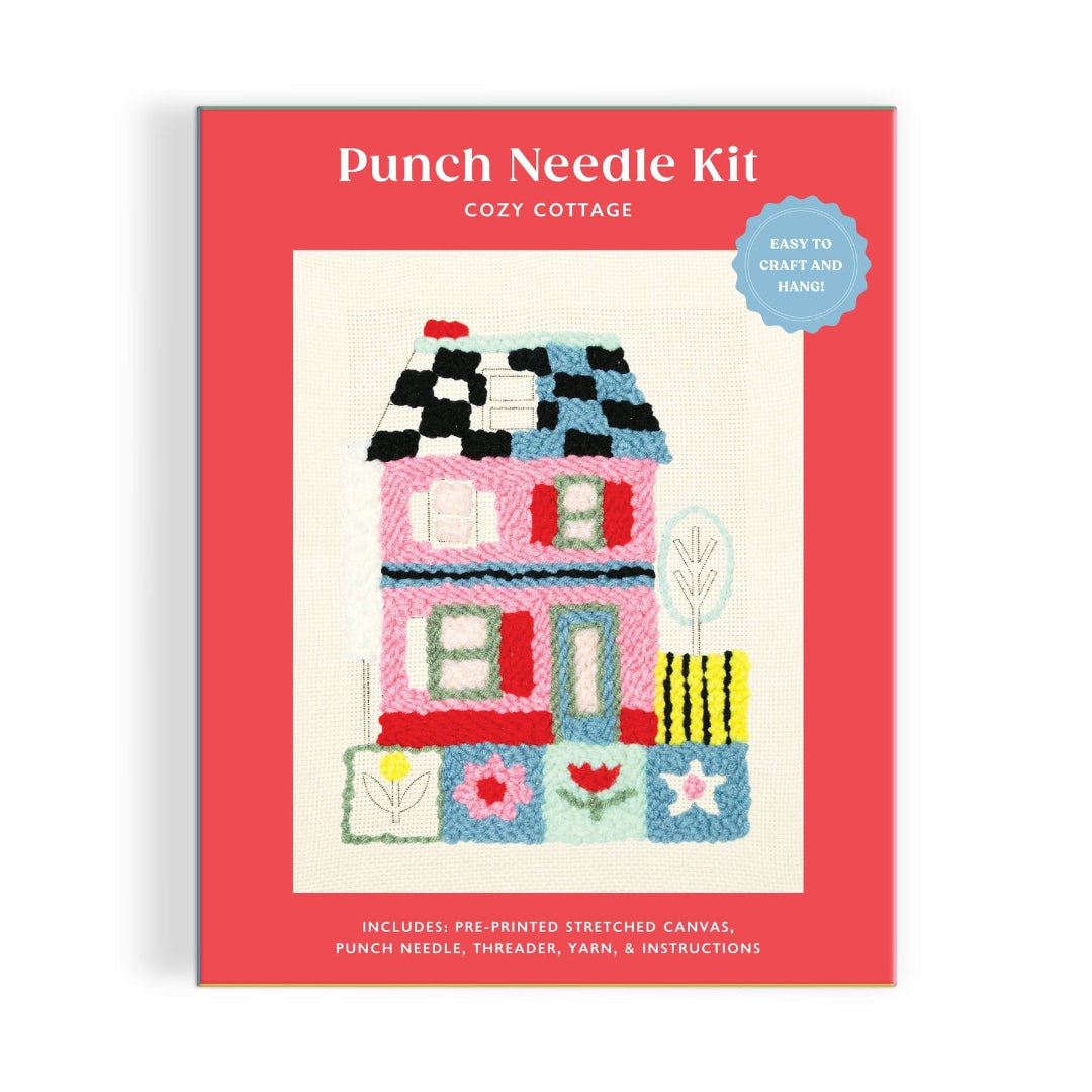 Punch needle kit packaging with a colorful house illustration on a red background