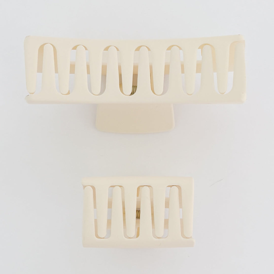 Decorative wall sconces with a geometric design on a white background