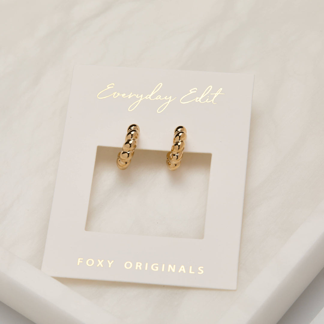 Gold hoop earrings on a 'Foxy Originals' branded card with 'Everyday Edit' text.