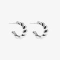 Silver hoop earrings on a white background