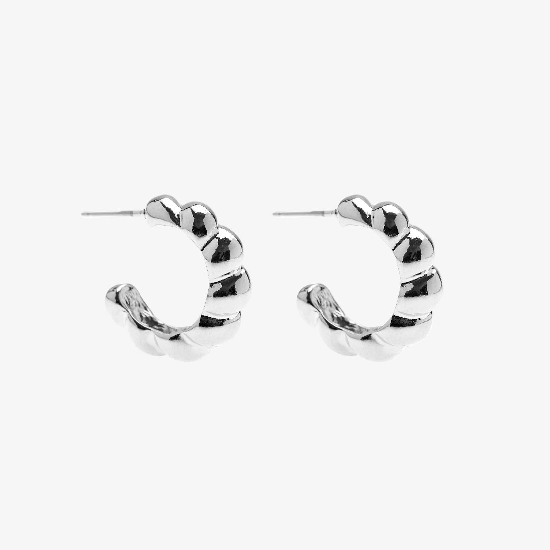 Silver hoop earrings on a white background