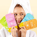 Woman holding Cryo face masks with a neutral background