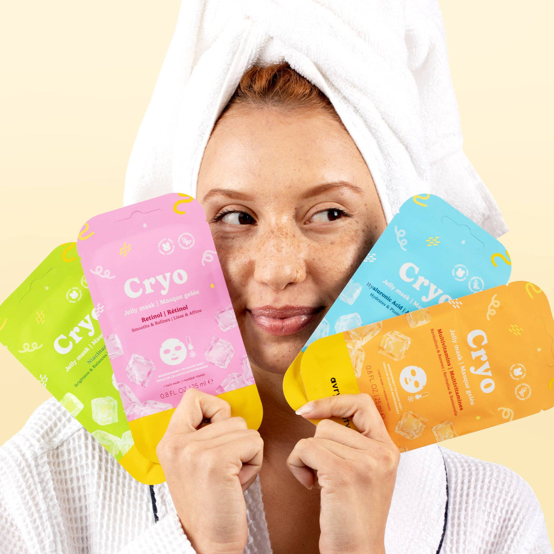 Woman holding Cryo face masks with a neutral background