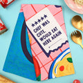 Colorful apron with text and food illustration on a blue background
