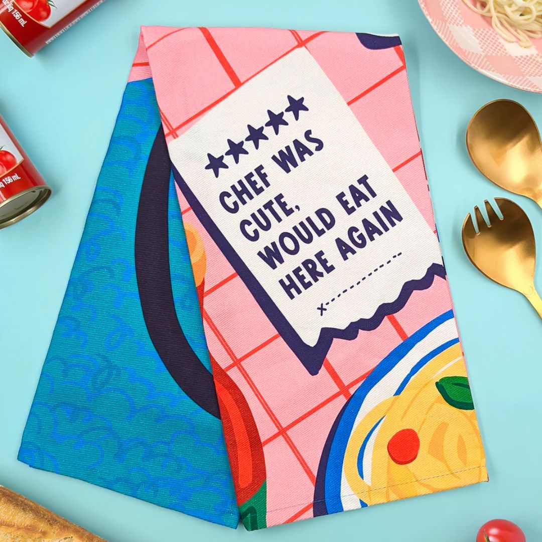 Colorful apron with text and food illustration on a blue background