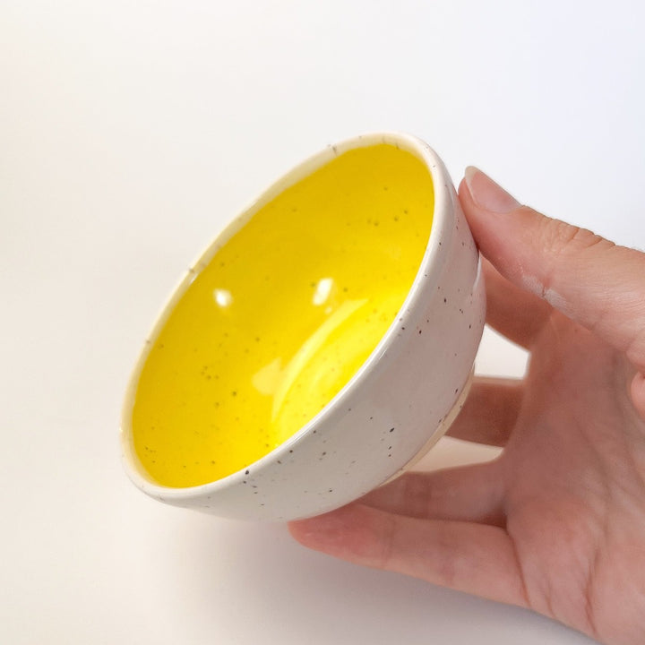 Yellow Colourful Trinket Dish, a small bowls with colour on the inside and speckled cream coloured clay on the outside.