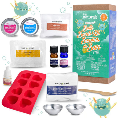A cardboard box containing a Kiss Naturals Bath Bomb Kit. The box is green and white with the product name and a colorful illustration of bath bombs. It states that the kit is 100% natural, made in Canada, and suitable for ages 6 and up.