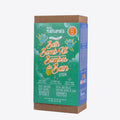 A cardboard box containing a Kiss Naturals Bath Bomb Kit. The box is green and white with the product name and a colorful illustration of bath bombs. It states that the kit is 100% natural, made in Canada, and suitable for ages 6 and up.