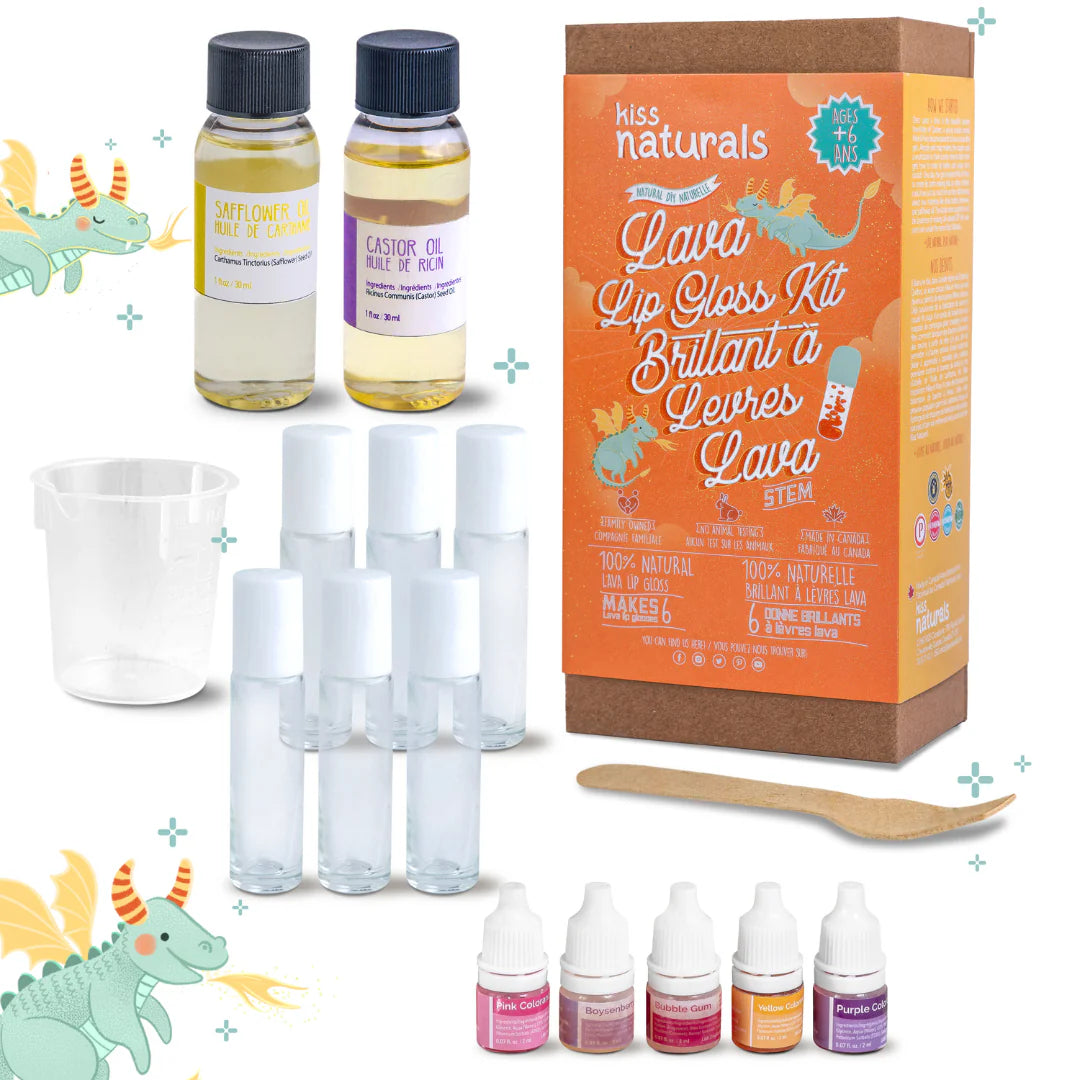 A cardboard box containing a Kiss Naturals Lava Lip Gloss Kit. The box is orange and white with the product name and a colorful illustration of a dragon. It states that the kit is 100% natural, made in Canada, and suitable for ages 6 and up.