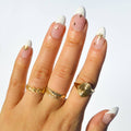 A sheet of Christmas-themed nail art stickers. The sheet is pink and has the brand name "Deco Beauty" printed on it. There's a section titled "Deco the Halls" and instructions on how to apply the stickers. The stickers include various Christmas-themed designs like snowflakes, bells, ornaments, and candy canes.