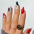 A sheet of Christmas-themed nail art stickers. The sheet is pink and has the brand name "Deco Beauty" printed on it. There's a section titled "Deco the Halls" and instructions on how to apply the stickers. The stickers include various Christmas-themed designs like snowflakes, bells, ornaments, and candy canes.