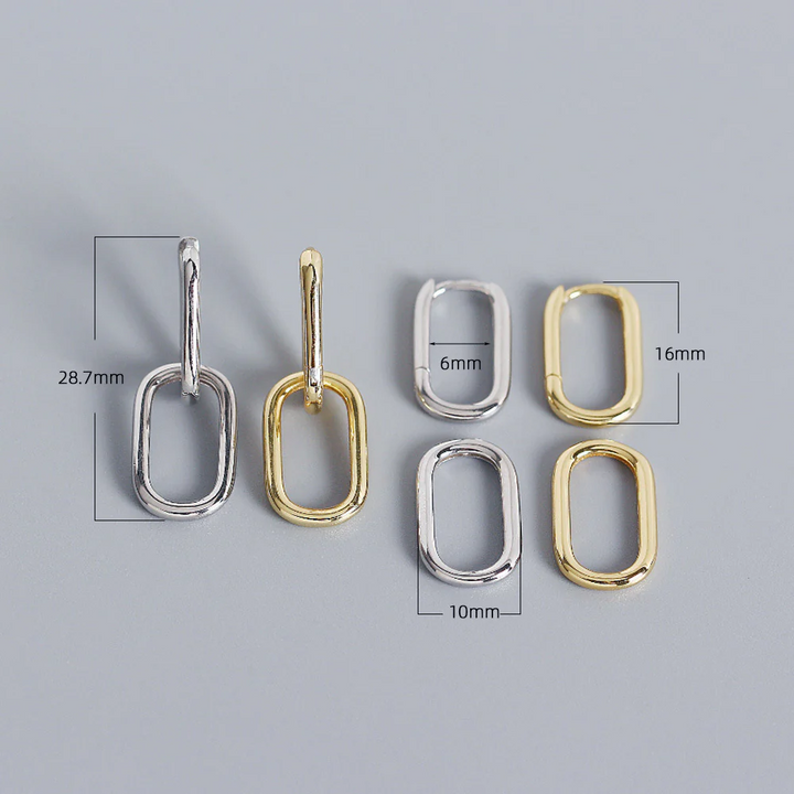 925 sterling silver geometric oval hoop earrings in silver and gold, featuring a small huggie hoop and a detachable elongated oval link, with dimension markings. These modern and versatile earrings are available in Ottawa, Ontario, Canada.