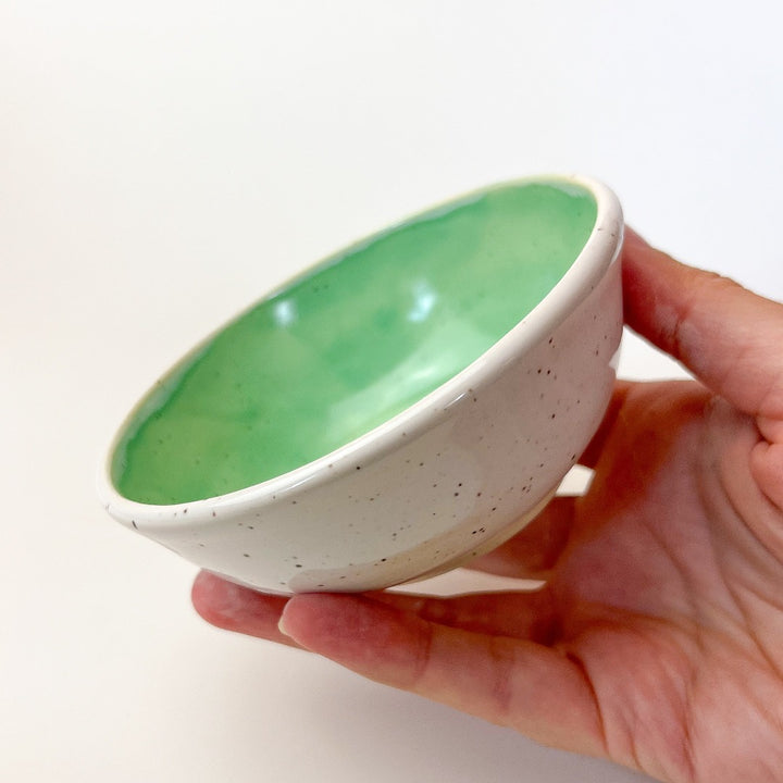 Green Colourful Trinket Dish, a small bowls with colour on the inside and speckled cream coloured clay on the outside.