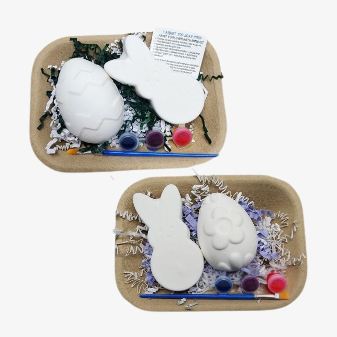 Two craft kits with bunny shapes, paint, and tools on a white background