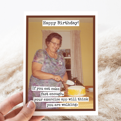 Birthday card with a vintage photo of a woman and humorous text on a fluffy surface.