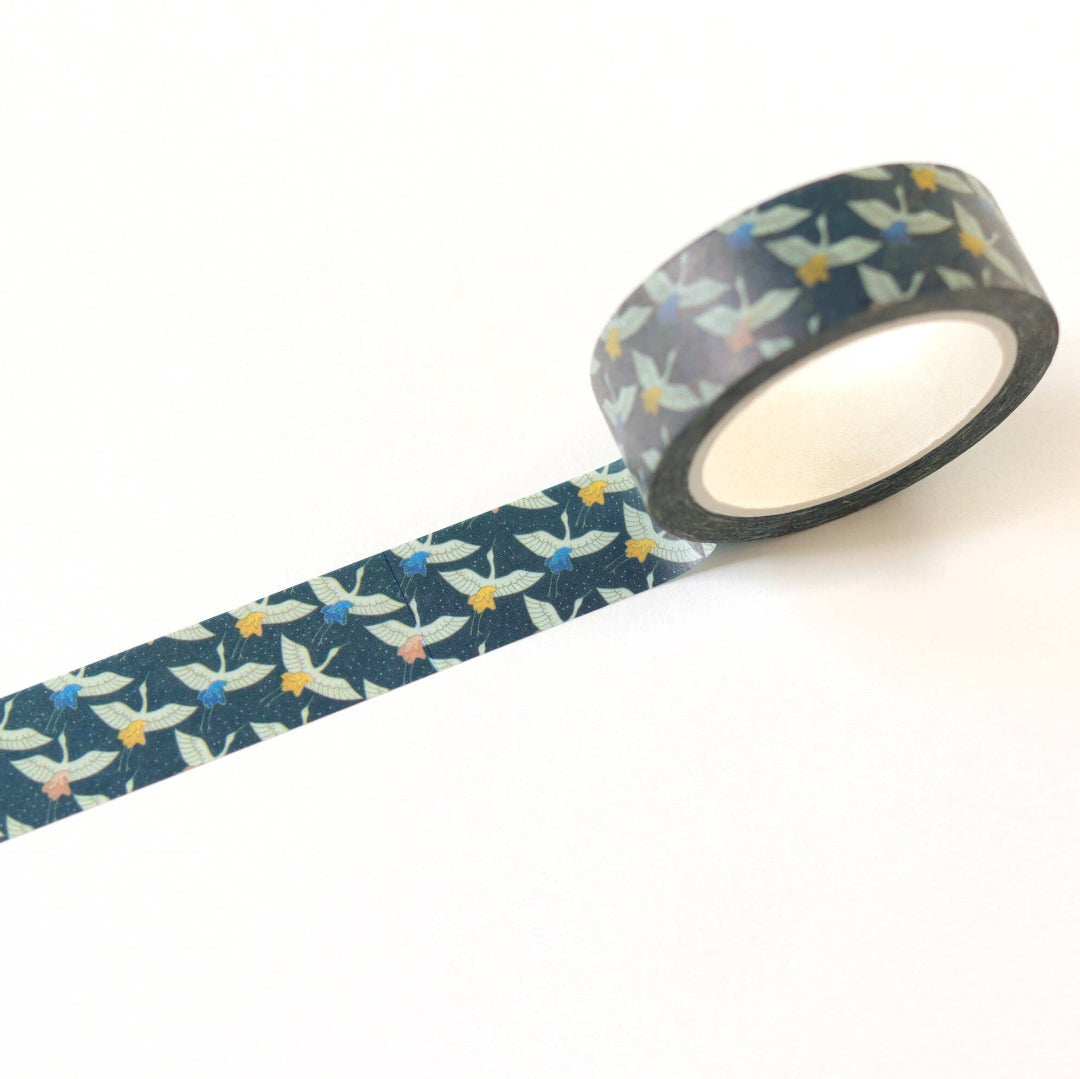 Roll of decorative tape with a floral pattern on a white background